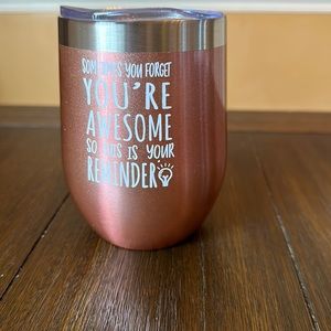 New Wine/coffee tumbler rose gold in color